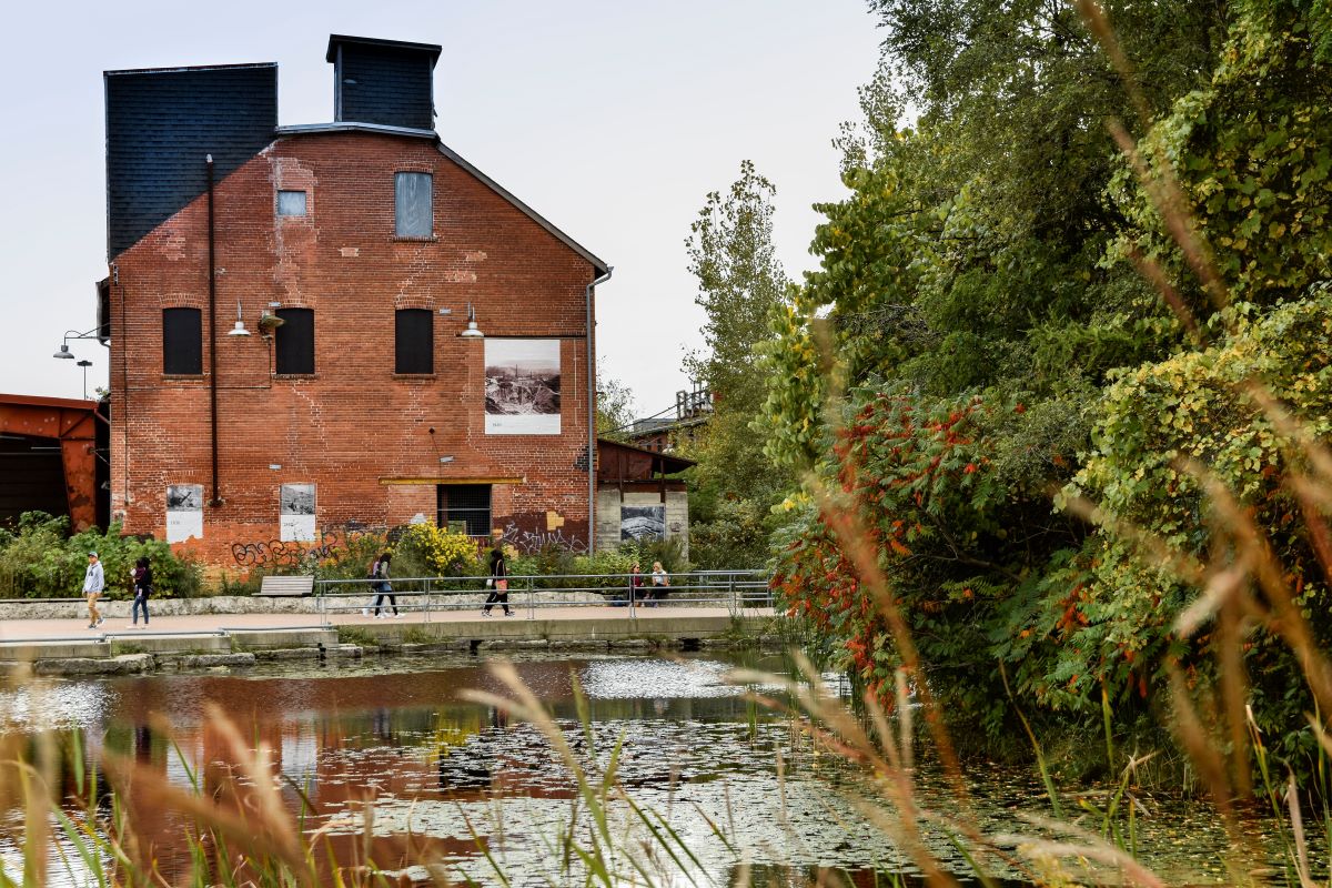 Evergreen Brick Works, Toronto — heritage brick building beside the pond